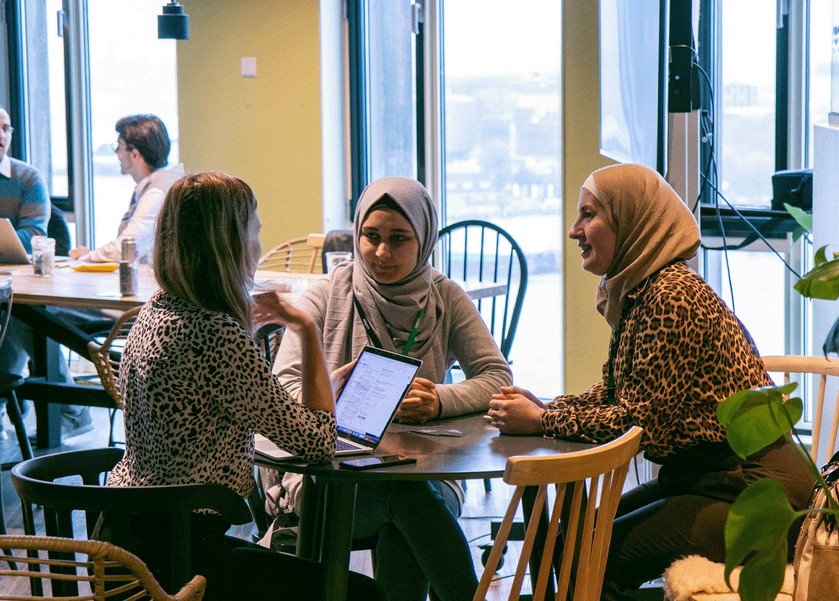 Women talking together at a table